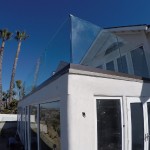 San Clemente Glass Railing With Bronze Base Shoe Installed